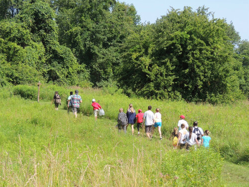 Campers hiking the trails at Mendon Ponds Park