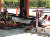 Campers enjoying a go-kart race.