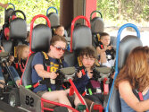 Campers enjoying a go-kart race.