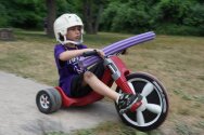 Camper riding tricycle