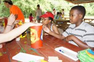 Campers decorating their totem pole!