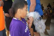 Camper blowing bubble snake