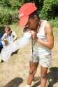Camper blowing bubble snake