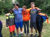 Young campers gathered together ready to jump in the water.