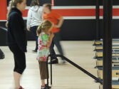 Counselors and campers working together to enjoy bowling.