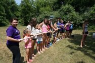 Groups playing water relay game