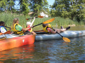 Lots of campers kayaking together.