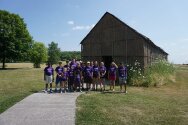 Camp tribe in front of long house