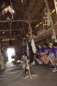 Campers & counselors sitting inside long house at Gonondagan